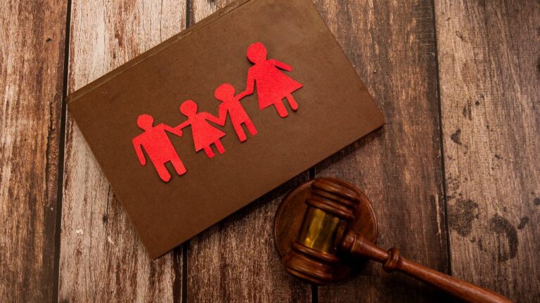 family paper figures and judge's gavel