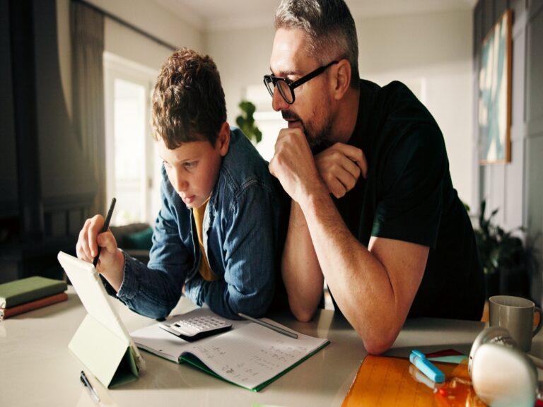 father helping son with homework